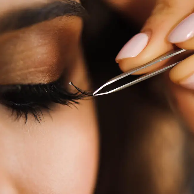 Close-up of a professional lash artist applying premium eyelash extensions at Sangkent Beauty House in Damansara Uptown.