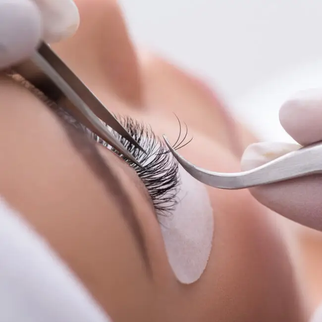 Professional eyelash extension application by an experienced lash artist at SangKent Beauty House.