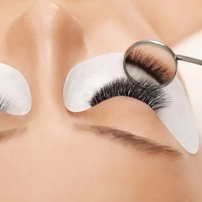 Close-up of a professional eyelash extension application using premium lashes at SangKent Beauty House